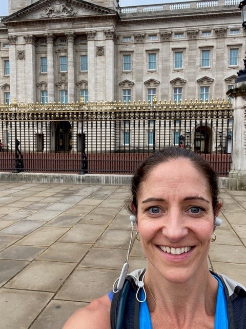 A lady stood in front of a building