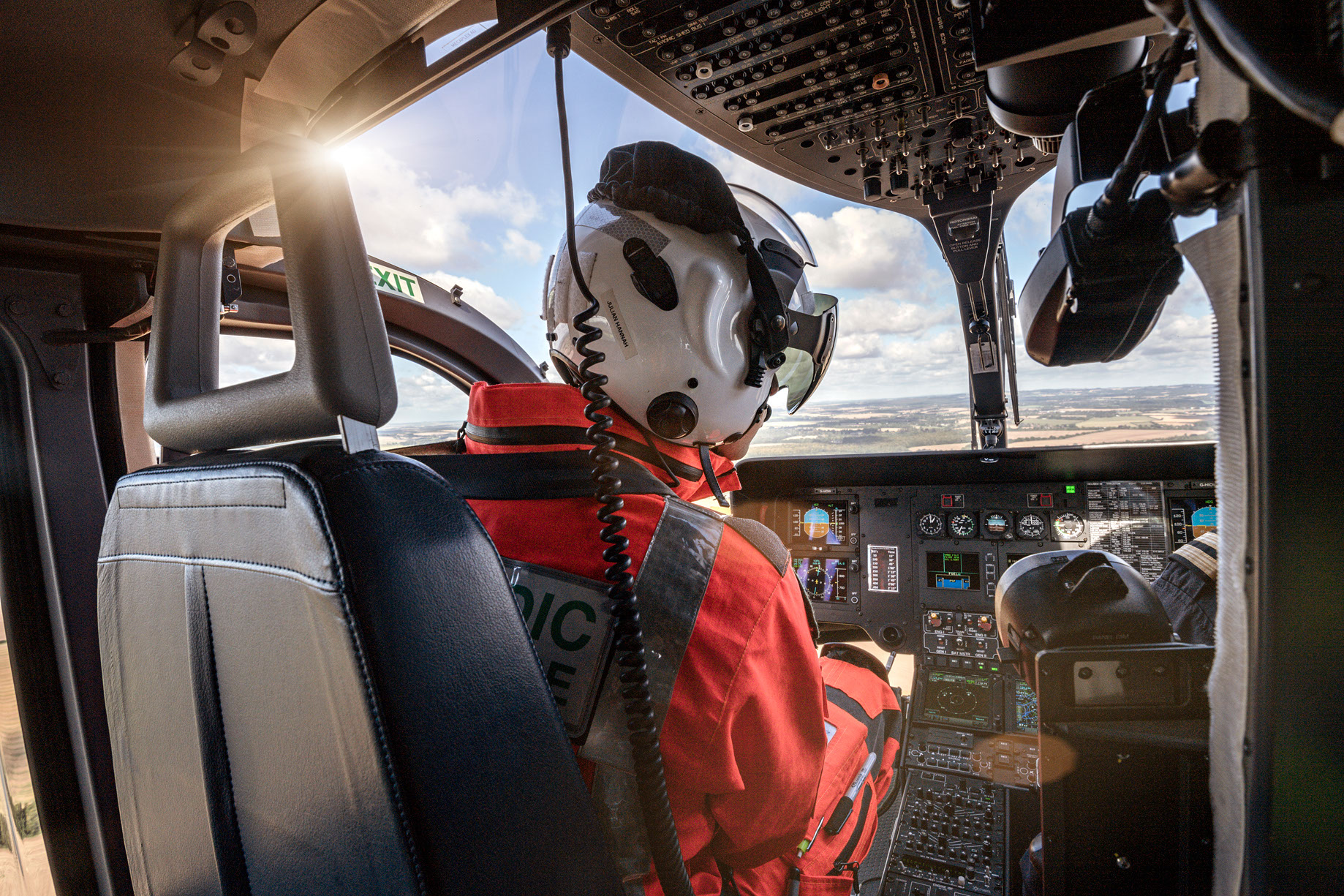 Hampshire and Isle of Wight Air Ambulance. Crew Member sat inside the helicopter whilst in flight _ABT9596