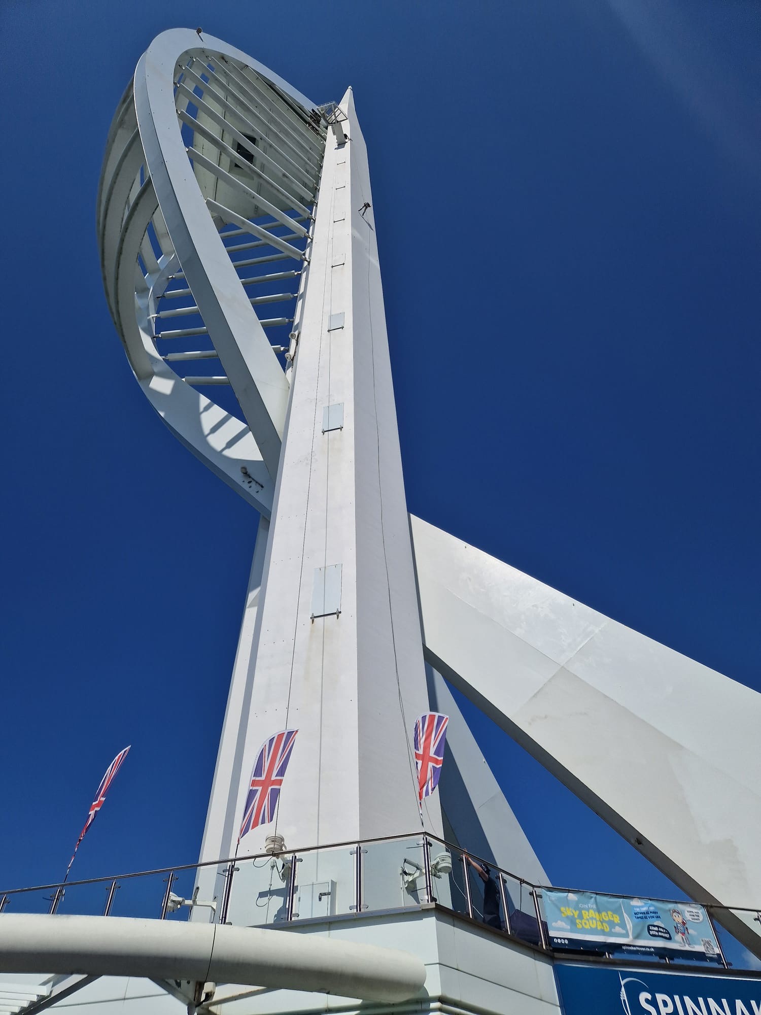 A man in the distance abseiling down the Spinnaker Tower